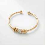Nina – Verstelbare gouden armband met bedels